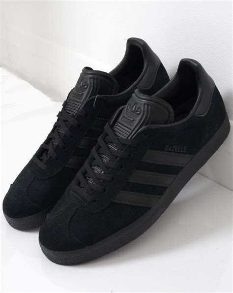 adidas gazelle trainers in black.